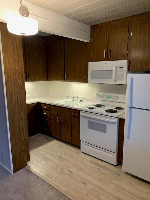 610 Walker Drive Mountain View, CA 94043 - Photo 14 of 23 a kitchen with a sink and a refrigerator
