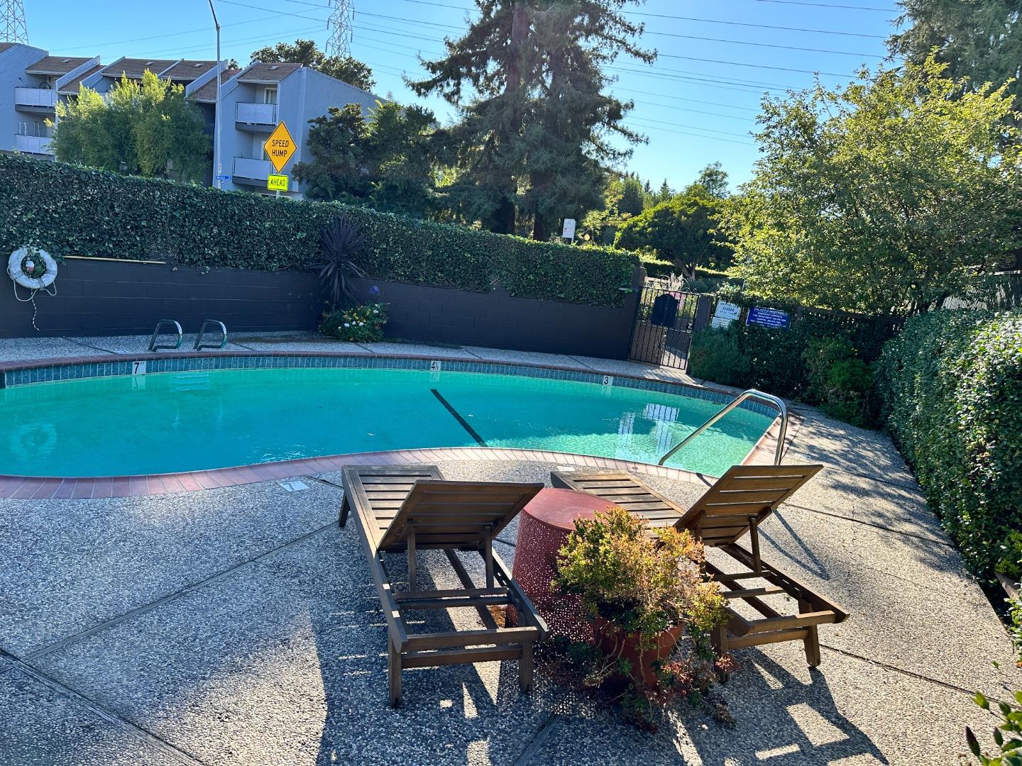 610 Walker Drive Mountain View, CA 94043 - Photo 9 of 23 a backyard of a house with table and chairs