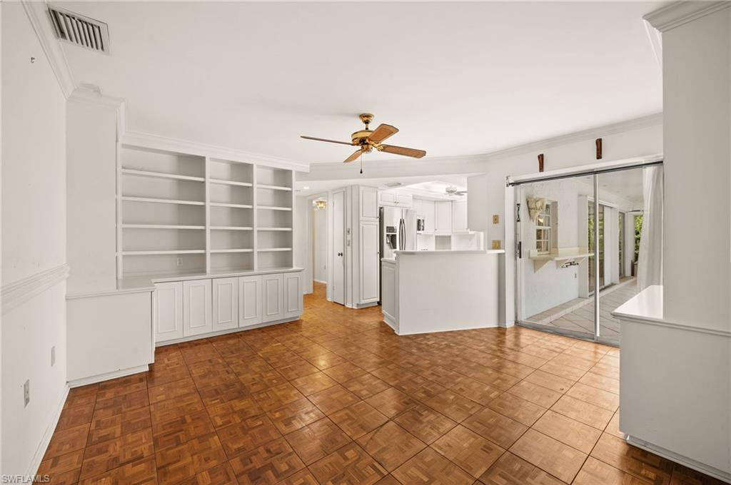 59 Pebble Beach Boulevard Naples, FL 34113 - Photo 13 of 32 a view of an empty room with a window