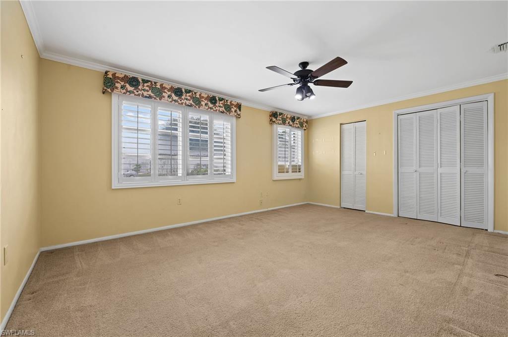 59 Pebble Beach Boulevard Naples, FL 34113 - Photo 16 of 32 a view of an empty room with a window