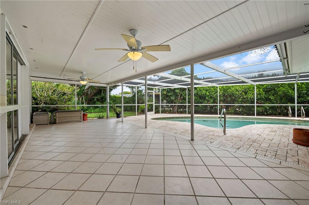 59 Pebble Beach Boulevard Naples, FL 34113 - Photo 24 of 32 a view of a backyard