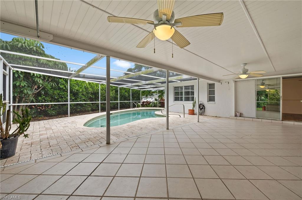 59 Pebble Beach Boulevard Naples, FL 34113 - Photo 25 of 32 a view of a room with windows