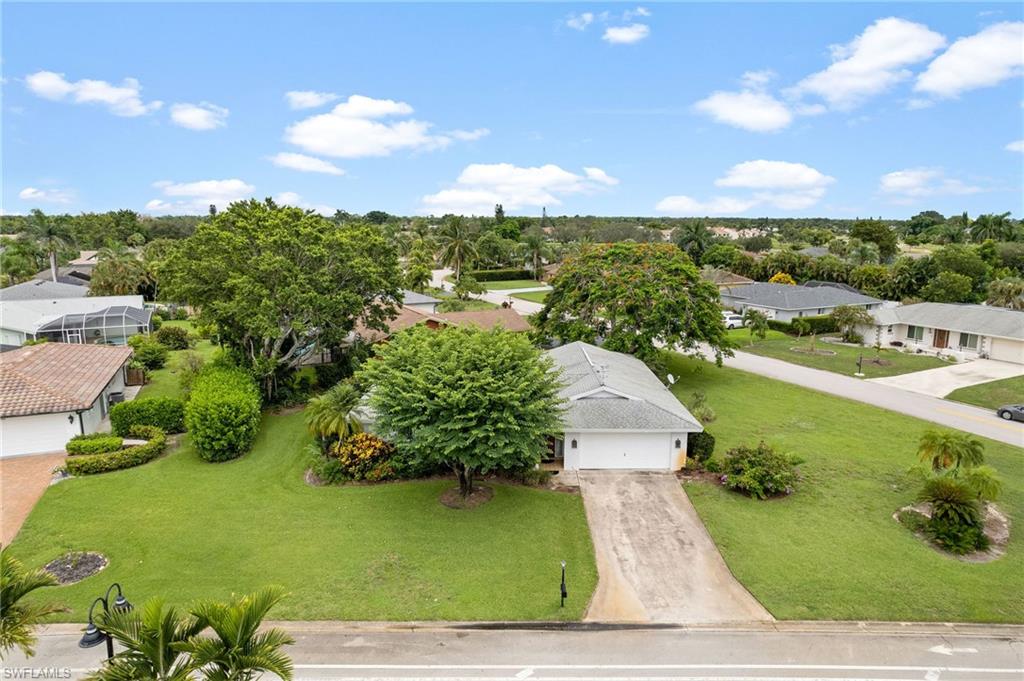 59 Pebble Beach Boulevard Naples, FL 34113 - Photo 27 of 32 an aerial view of a house