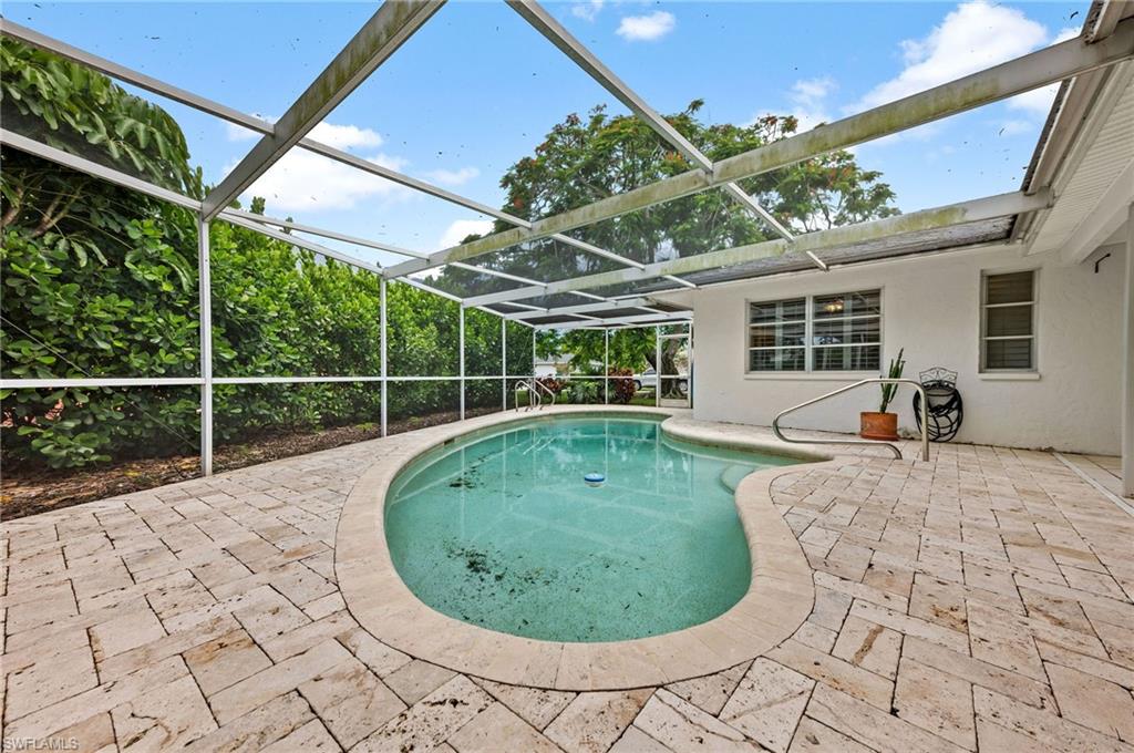 59 Pebble Beach Boulevard Naples, FL 34113 - Photo 30 of 32 a view of a backyard