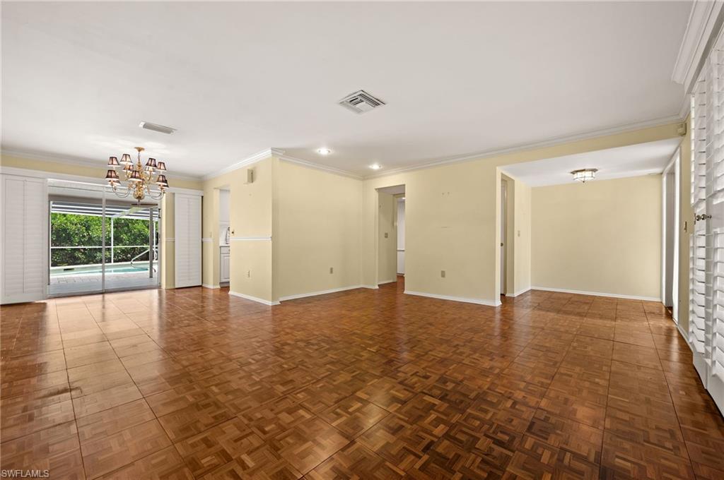 59 Pebble Beach Boulevard Naples, FL 34113 - Photo 5 of 32 a view of an empty room with a window