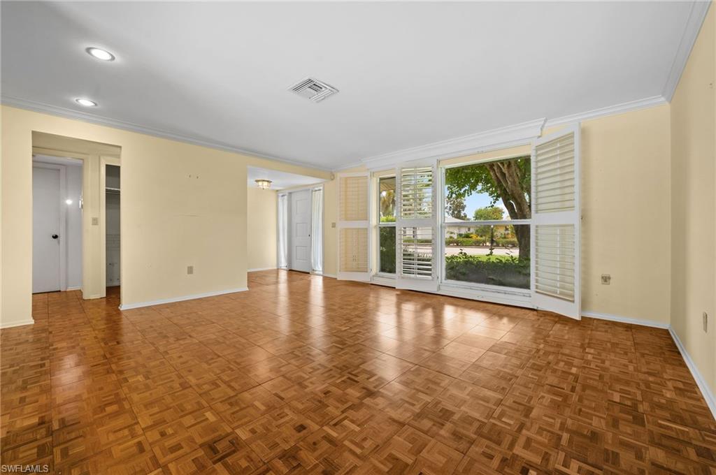59 Pebble Beach Boulevard Naples, FL 34113 - Photo 7 of 32 a view of an empty room with a window