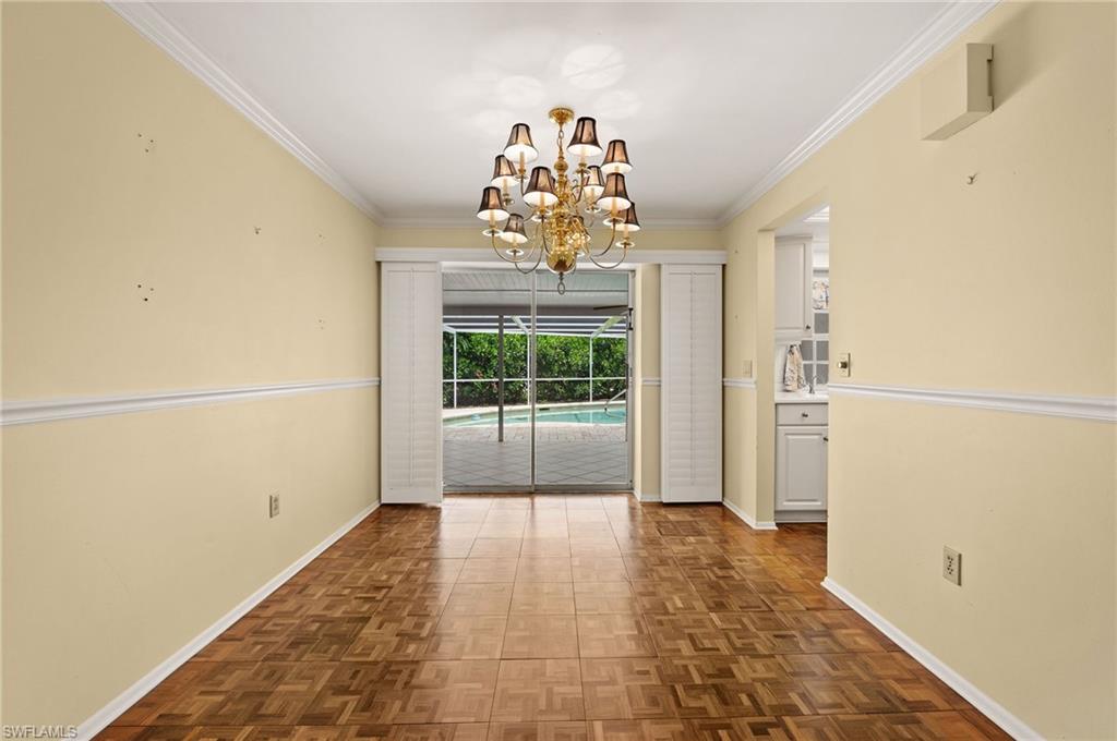 59 Pebble Beach Boulevard Naples, FL 34113 - Photo 8 of 32 a view of entryway with chandelier