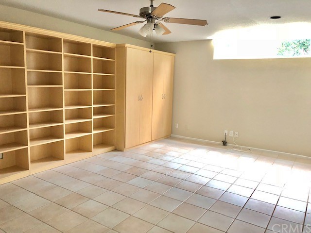 5 Torrigiani Aisle Irvine, CA 92606 - Photo 13 of 28 a view of an empty room and window and chandelier fan
