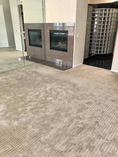 5 Torrigiani Aisle Irvine, CA 92606 - Photo 23 of 28 a view of an empty room with a fireplace