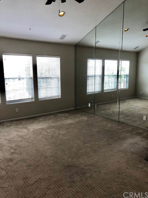 5 Torrigiani Aisle Irvine, CA 92606 - Photo 24 of 28 a view of an empty room with a window
