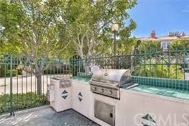 5 Torrigiani Aisle Irvine, CA 92606 - Photo 25 of 28 a view of a garden with iron fence
