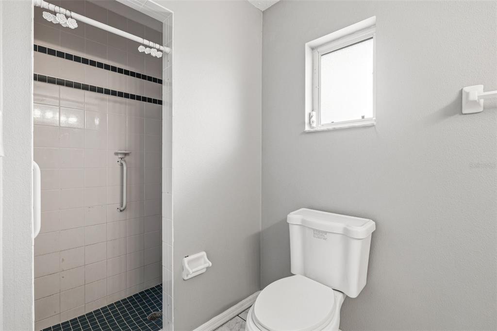 7510 Ligustrum Punta Gorda, FL 33955 - Photo 13 of 25 a white toilet sitting next to a bathroom sink