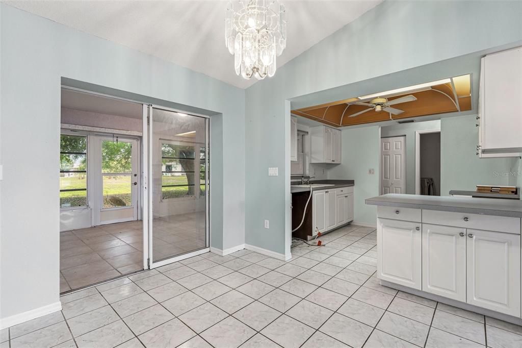 7510 Ligustrum Punta Gorda, FL 33955 - Photo 6 of 25 a kitchen with white cabinets and appliances