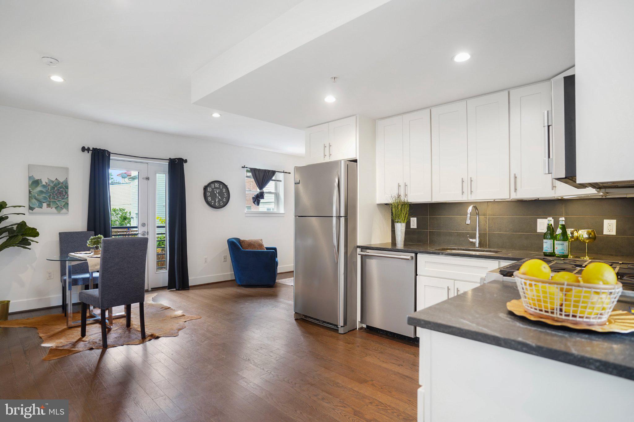 7723 Alaska Avenue Northwest, Unit 103 Washington, DC 20012 - Photo 12 of 12 Modern kitchen with inviting layout.