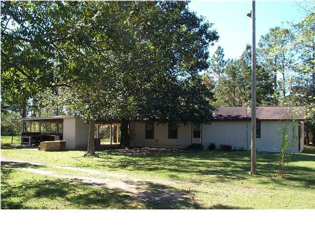 6161 Barnes Road Crestview, FL 32536 - Photo 3 of 3 a house with swimming pool in front of it