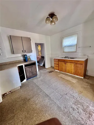a view of a livingroom with furniture and staircase