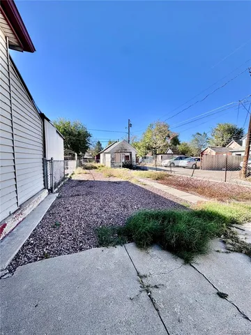 a view of a yard with a car parked