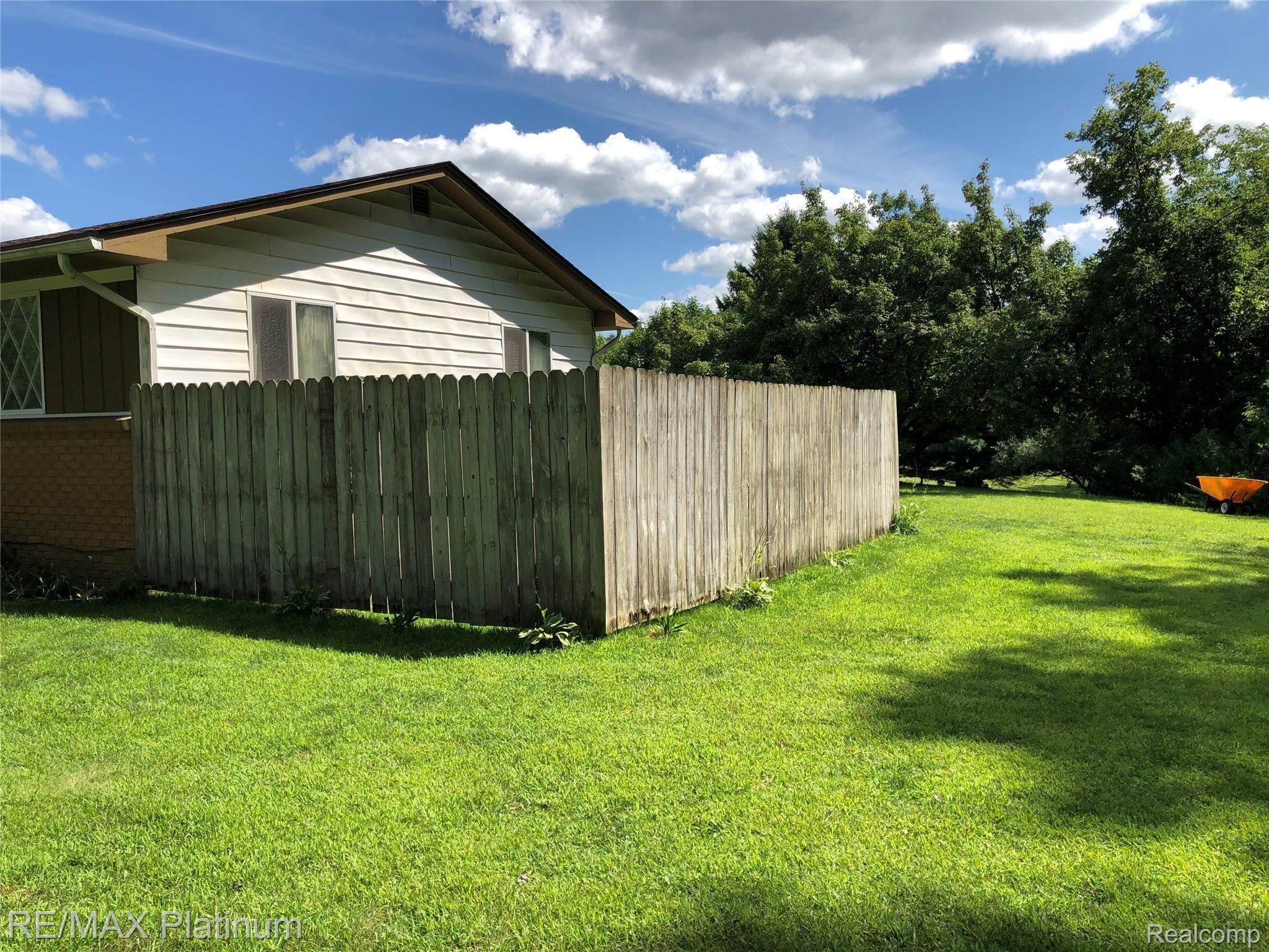 5625 Richardson Road Howell, MI 48843 - Photo 20 of 22 Side Yard with Fenced In Area