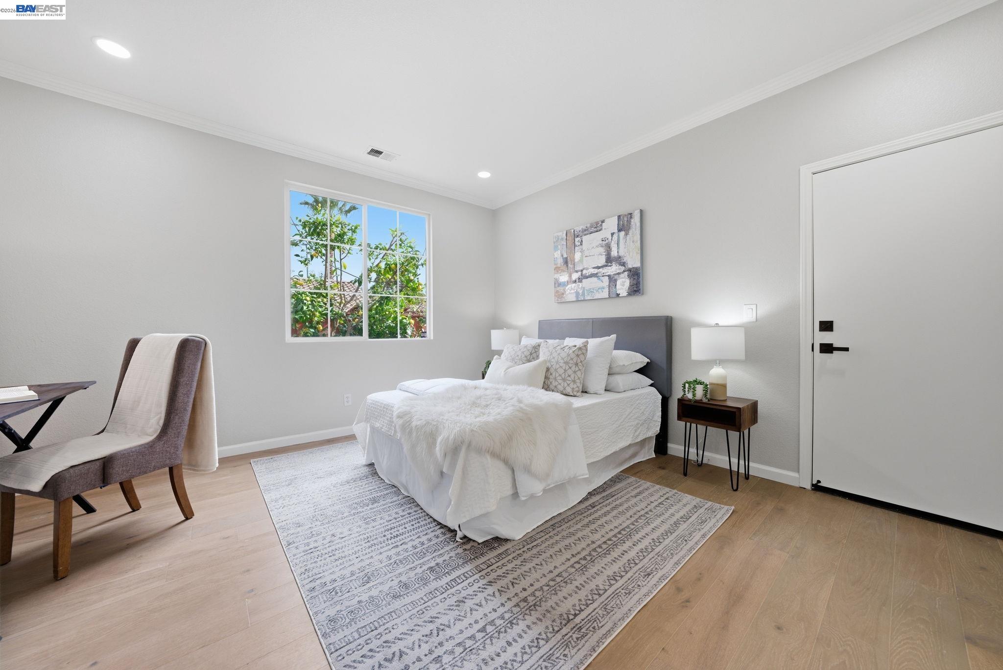 177 Elisha Lane San Ramon, CA 94583 - Photo 23 of 43 a spacious bedroom with a bed a couch and a window with chair