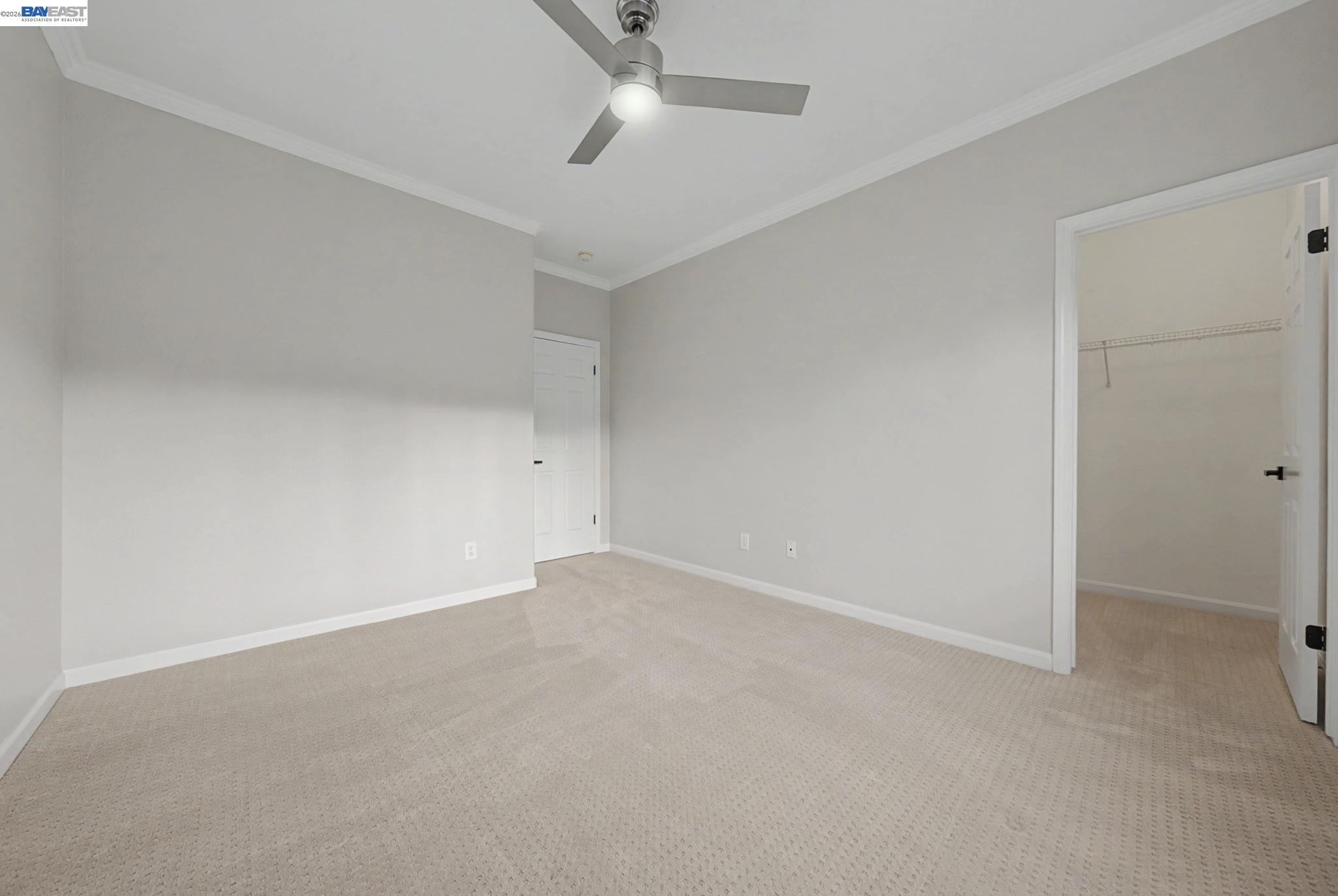 177 Elisha Lane San Ramon, CA 94583 - Photo 26 of 43 an empty room with a ceiling fan and carpet