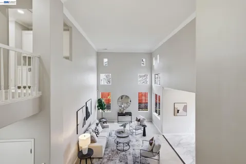 a view of a very nice looking dining room with a table and chairs