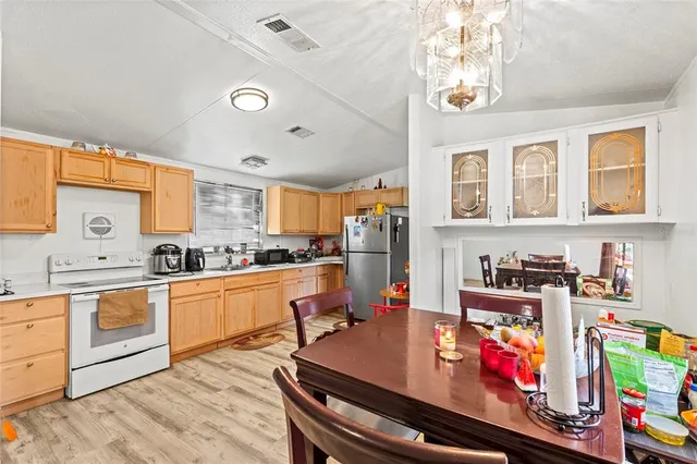 a open kitchen with stainless steel appliances granite countertop a stove and cabinets