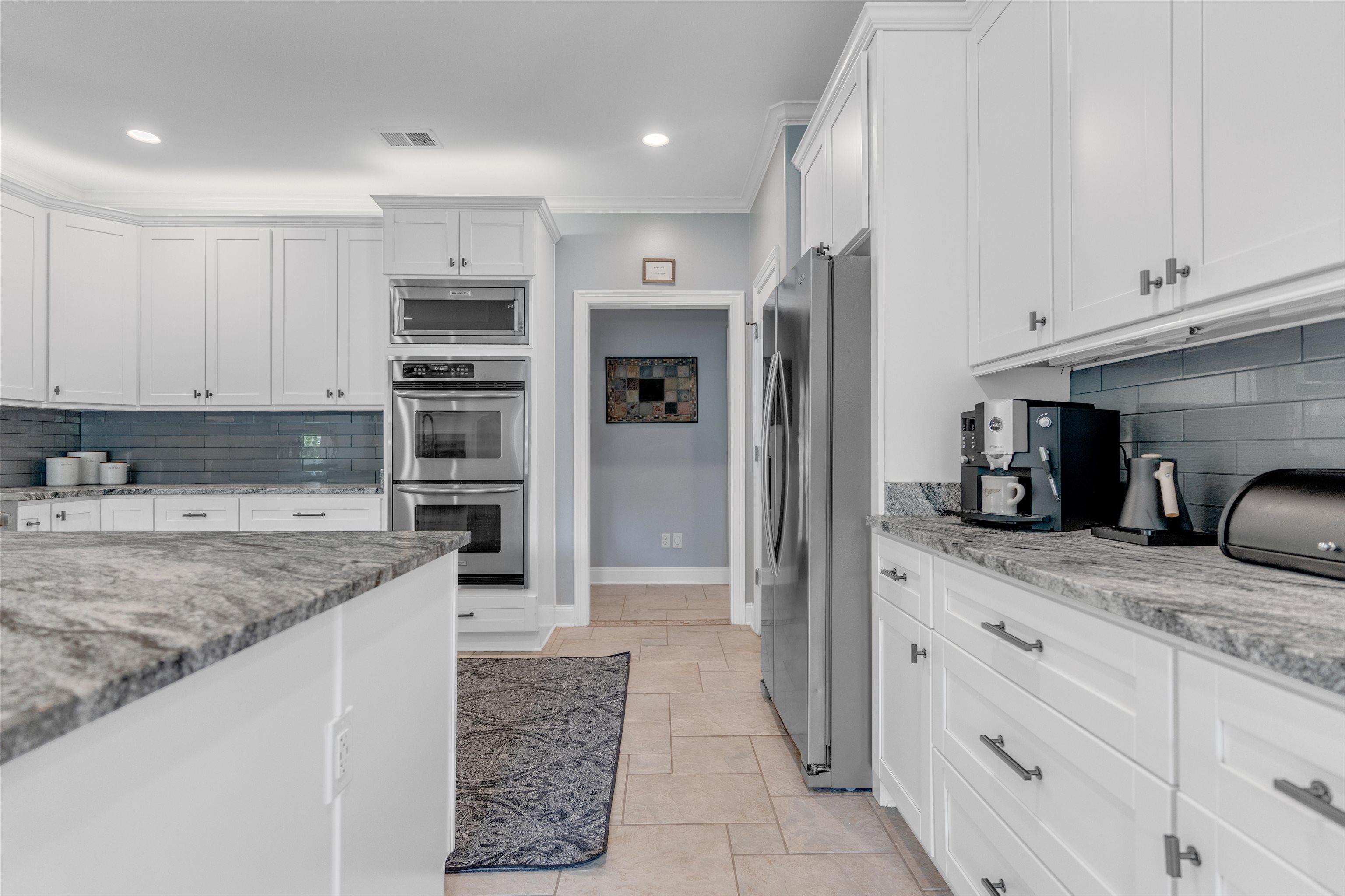 1075 Summer Spring Road Collierville, TN 38017 - Photo 12 of 40 a kitchen with stainless steel appliances granite countertop a refrigerator and a sink