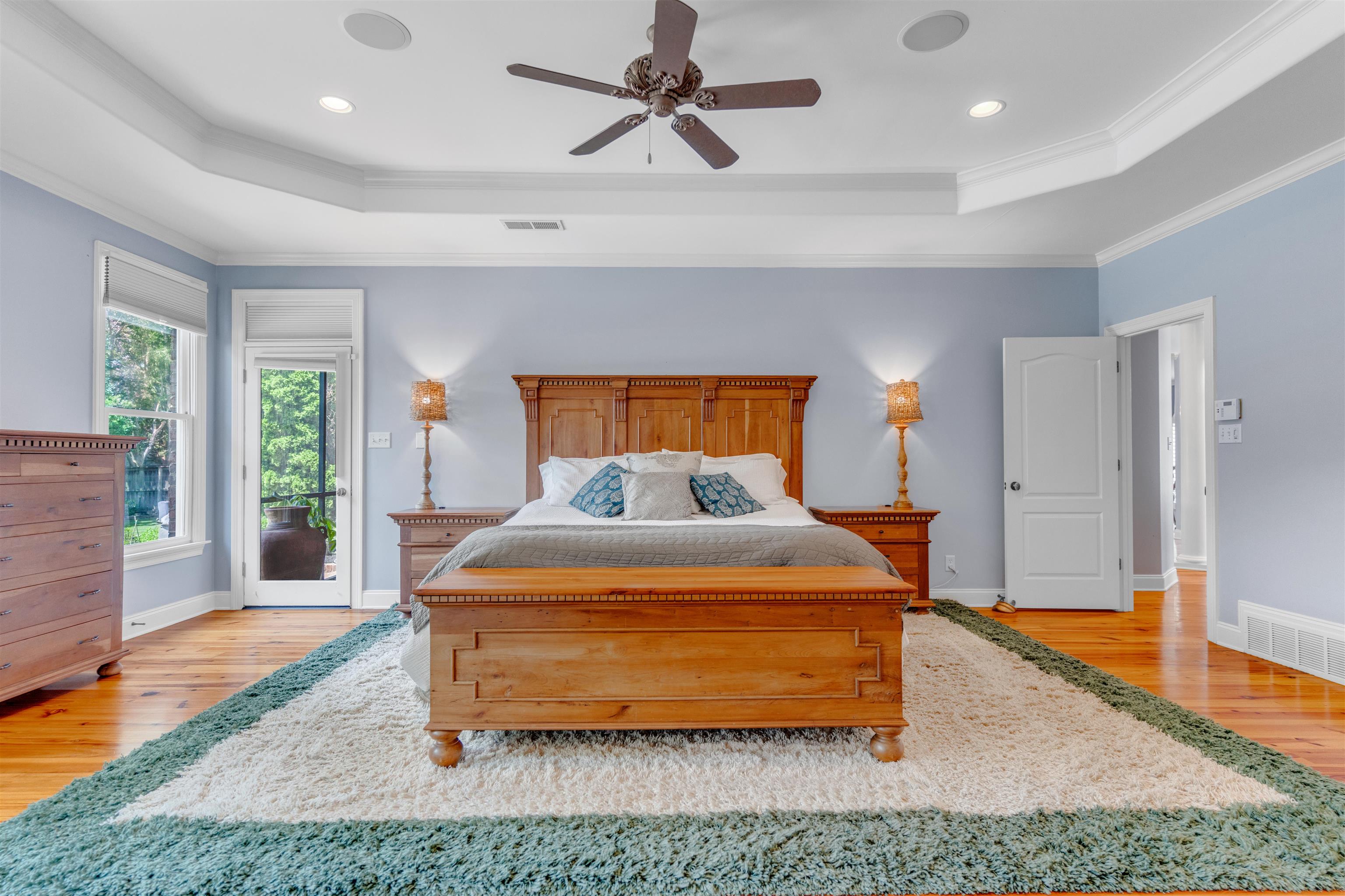 1075 Summer Spring Road Collierville, TN 38017 - Photo 16 of 40 a bedroom with a bed and wooden floor