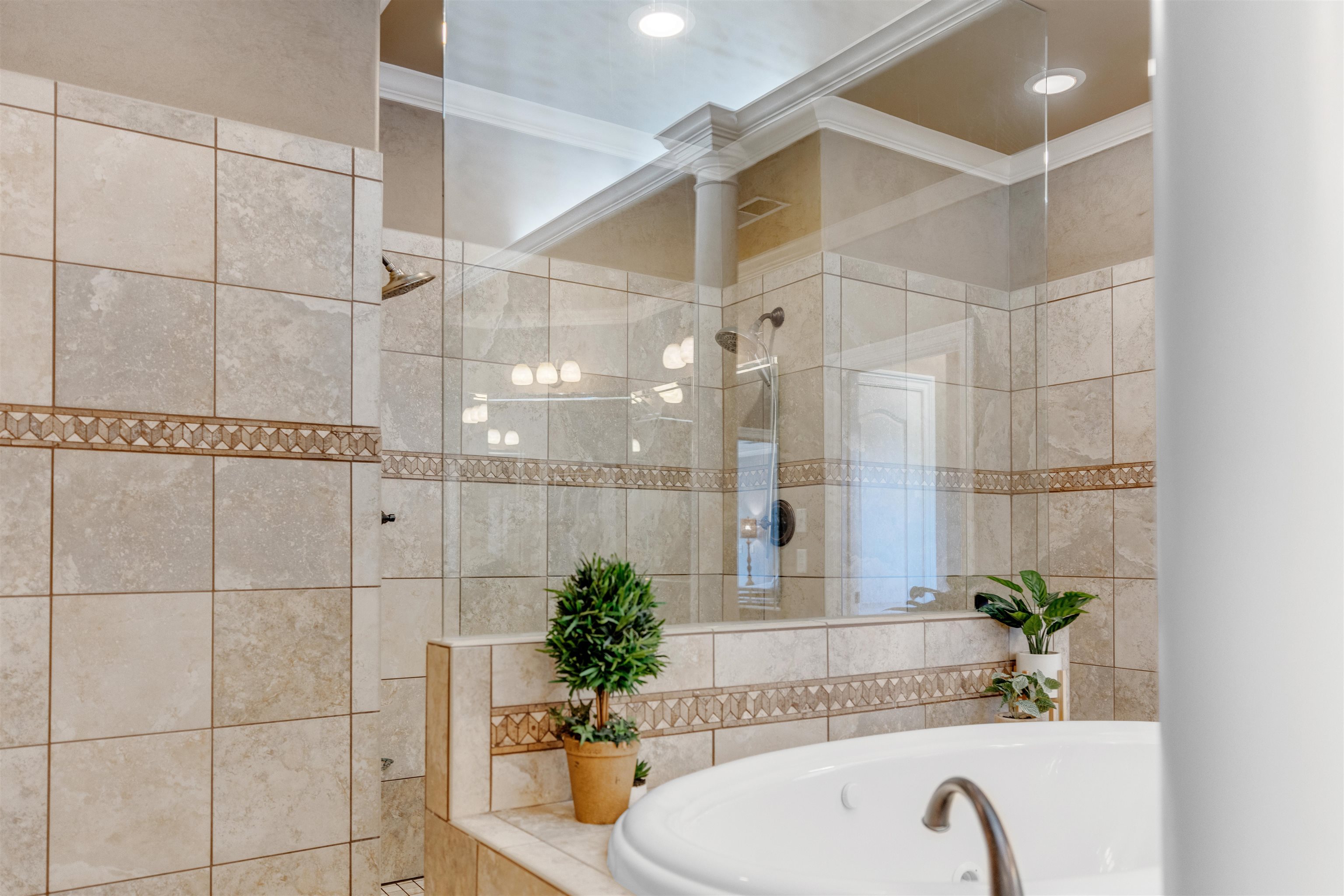 1075 Summer Spring Road Collierville, TN 38017 - Photo 21 of 40 a bathroom with a bathtub and shower