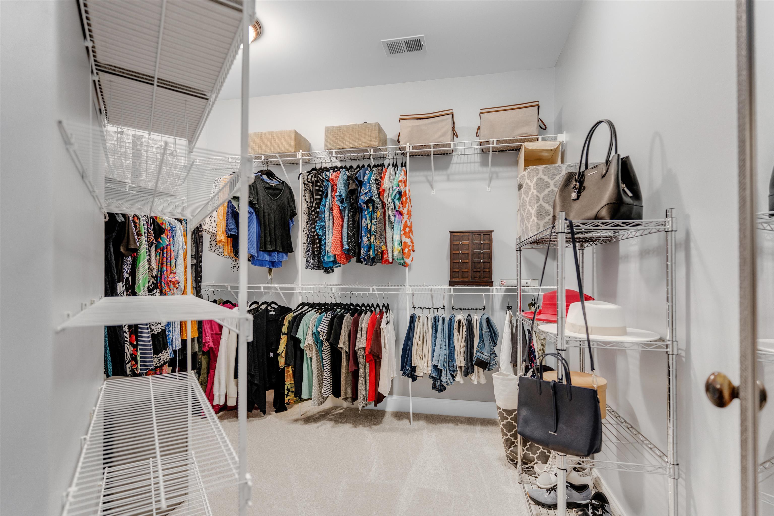 1075 Summer Spring Road Collierville, TN 38017 - Photo 22 of 40 a view of walk in closet with clothes and shoes