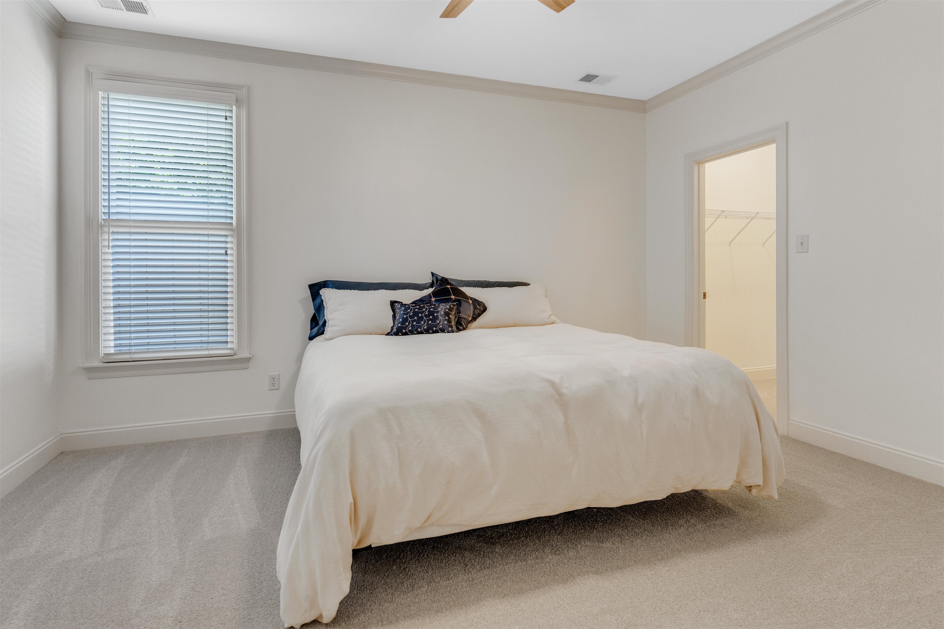1075 Summer Spring Road Collierville, TN 38017 - Photo 23 of 40 a large bed sitting in a bedroom next to a window