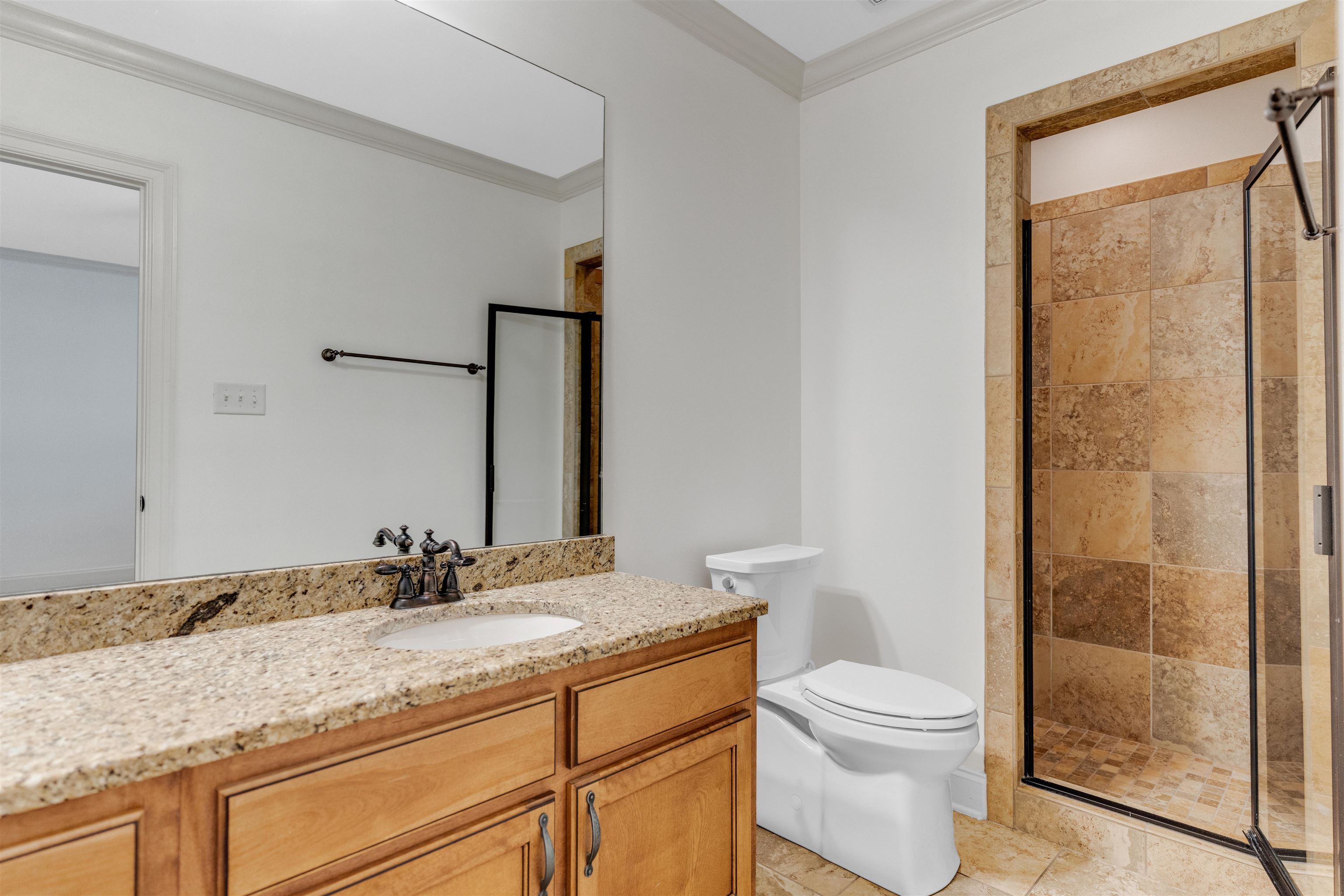 1075 Summer Spring Road Collierville, TN 38017 - Photo 24 of 40 a bathroom with a granite countertop sink toilet and shower