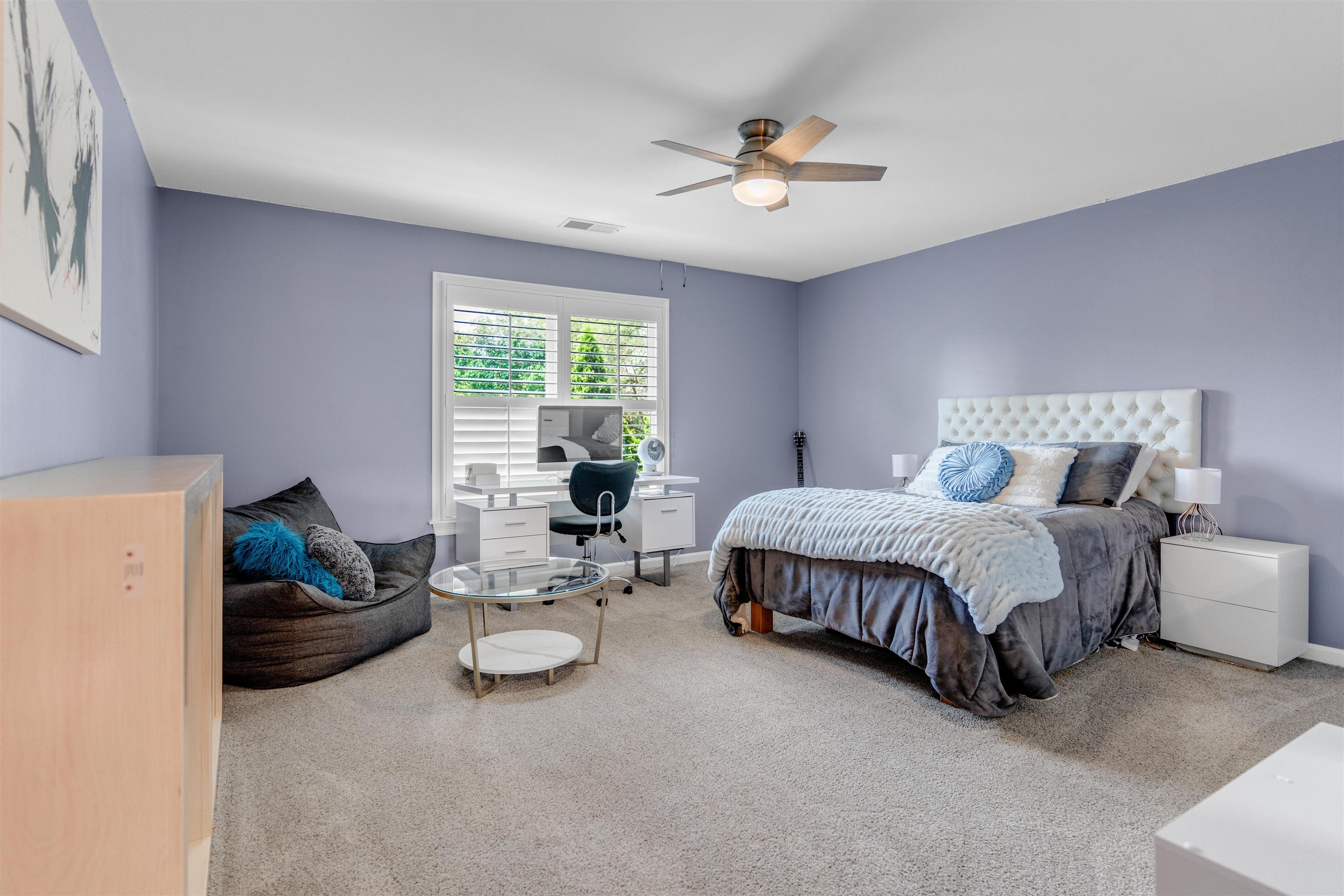 1075 Summer Spring Road Collierville, TN 38017 - Photo 27 of 40 a spacious bedroom with a bed and furniture