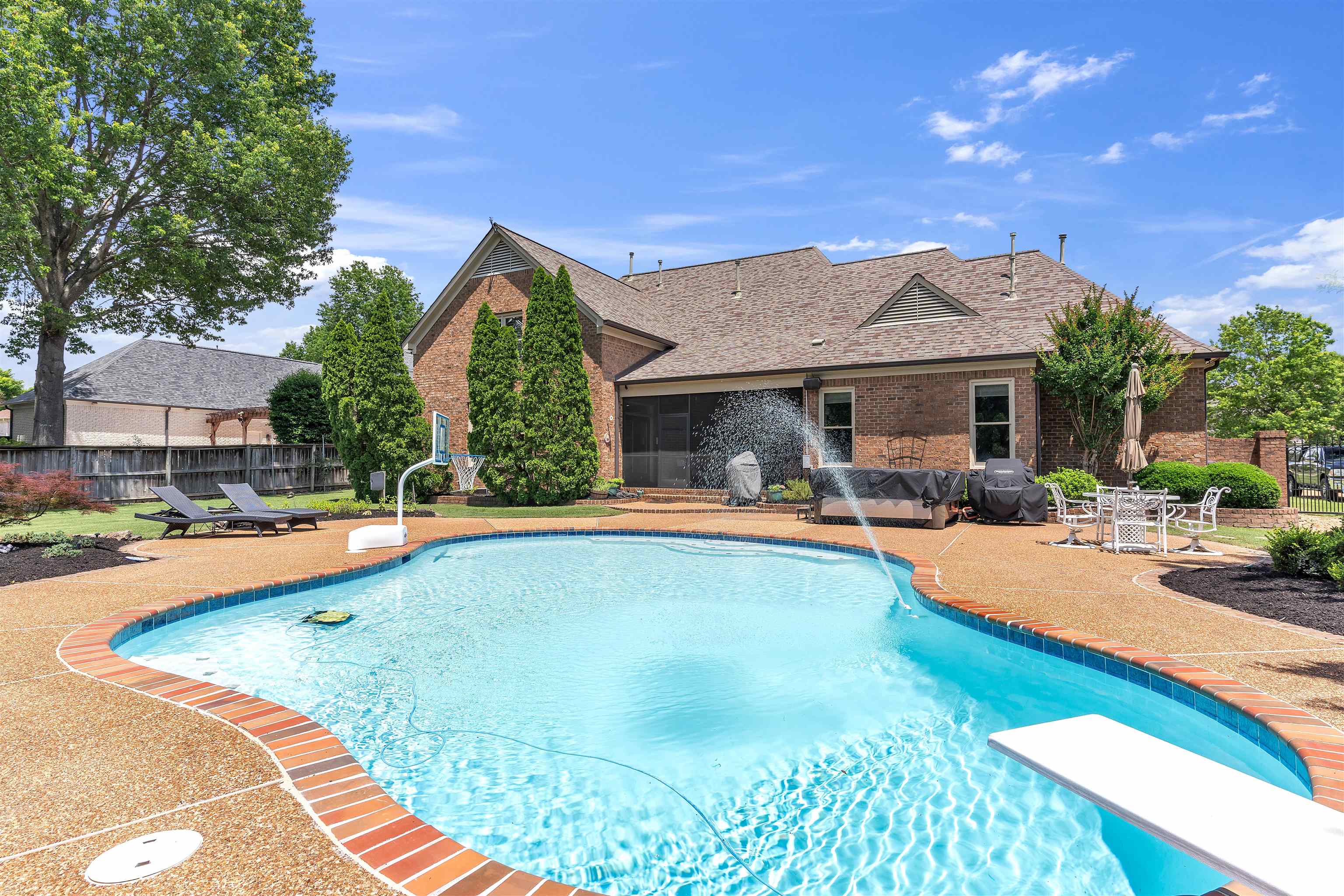 1075 Summer Spring Road Collierville, TN 38017 - Photo 33 of 40 a view of a house with swimming pool and sitting area