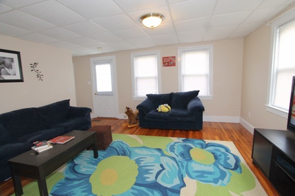 424 Putnam Hill Road Sutton, MA 01590 - Photo 2 of 12 a living room with furniture and a rug