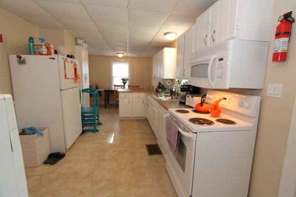 424 Putnam Hill Road Sutton, MA 01590 - Photo 4 of 12 a kitchen that has a sink and a refrigerator