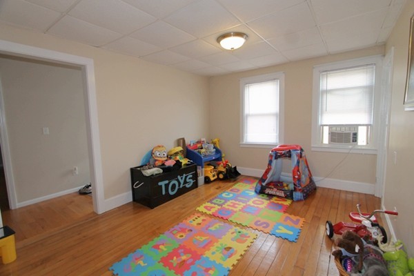 424 Putnam Hill Road Sutton, MA 01590 - Photo 5 of 12 a bedroom with a bed and wooden floor