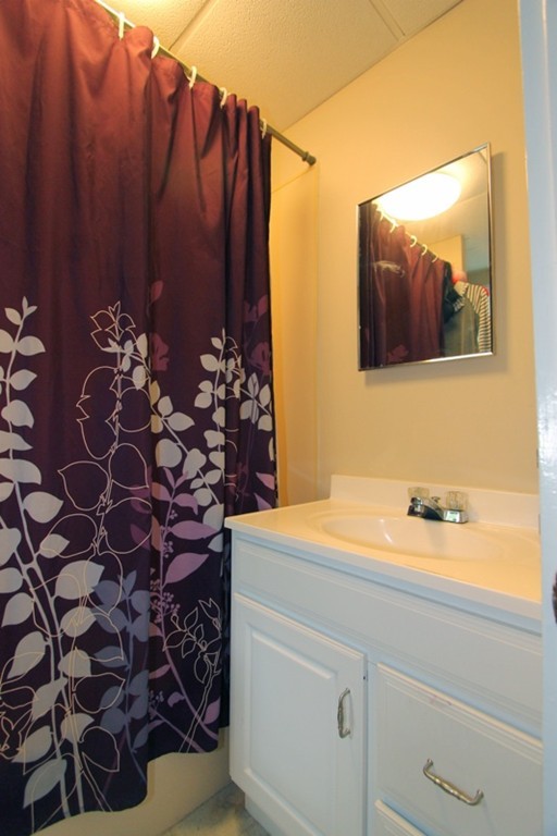 424 Putnam Hill Road Sutton, MA 01590 - Photo 6 of 12 a bathroom with a sink and a mirror