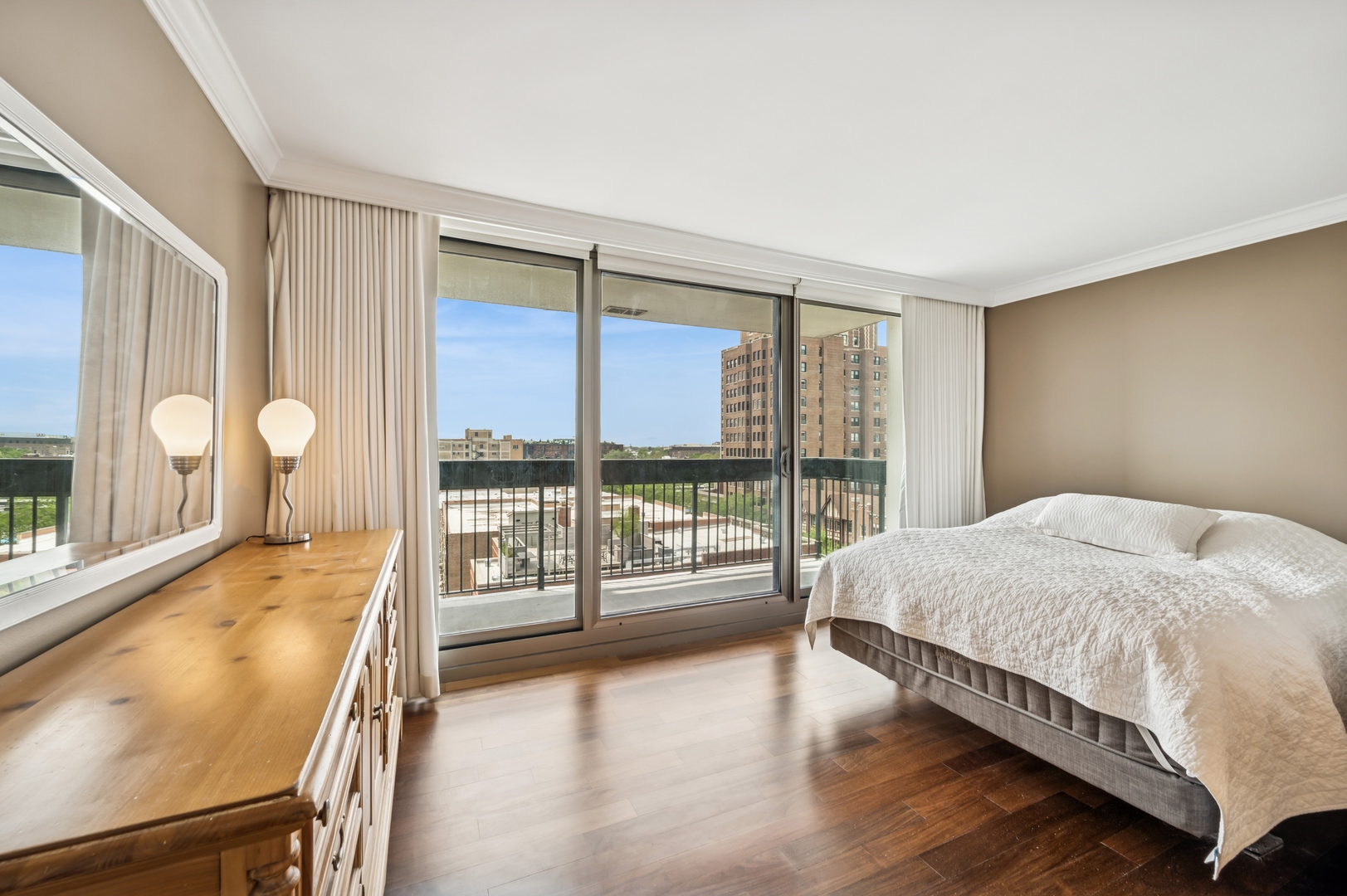 3470 North Lake Shore Drive, Unit 9BC Chicago, IL 60657 - Photo 18 of 21 a spacious bedroom with a large bed and wooden floor