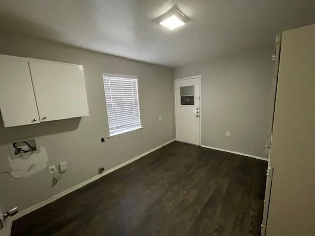 an empty room with a empty space and windows