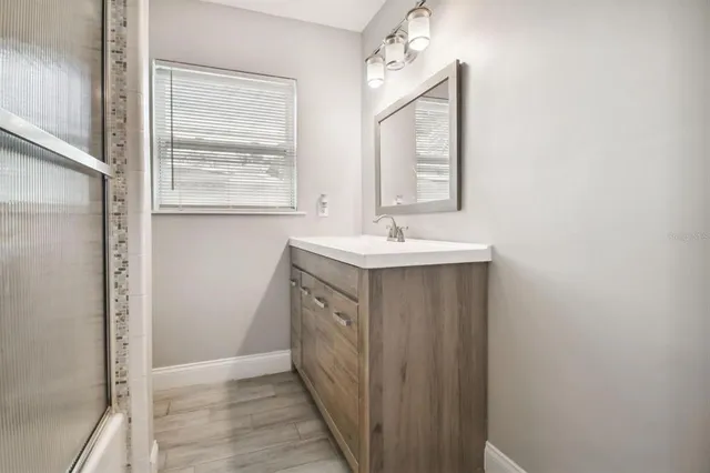 a bathroom with 2 sink and a mirror