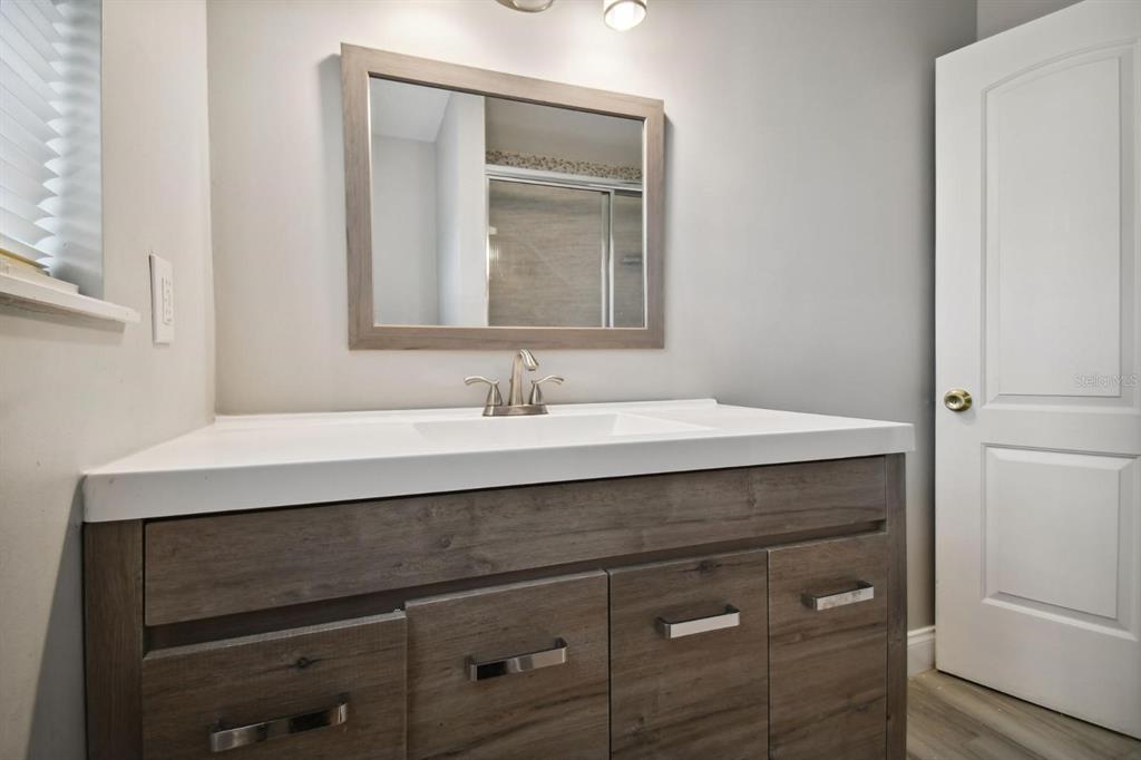 6745 Ralston Beach Circle Tampa, FL 33614 - Photo 26 of 39 a sink with a mirror