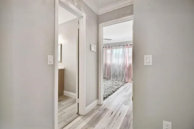 a view of a bathroom from a hallway