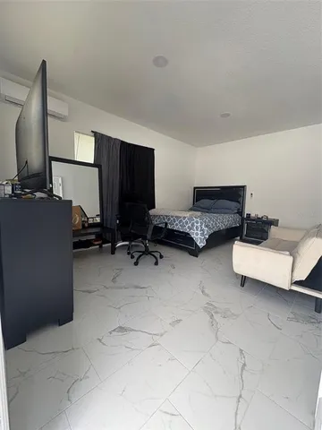 a room with furniture and a flat screen tv