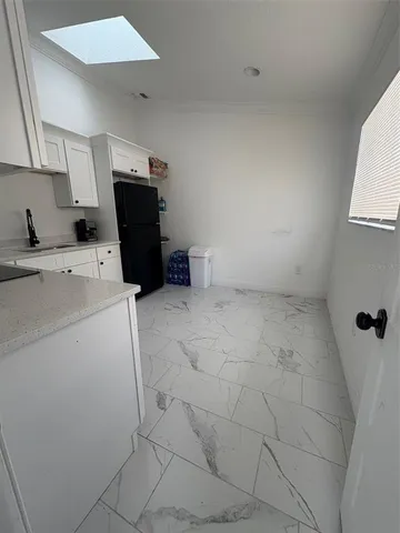 a view of storage and utility room with washer and dryer