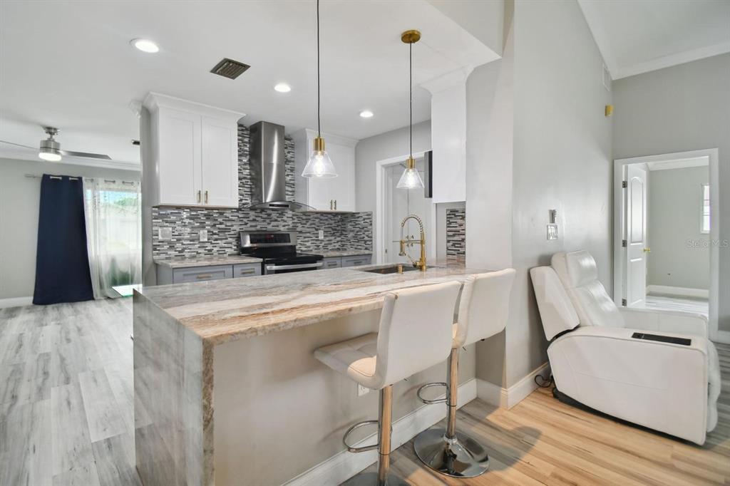 6745 Ralston Beach Circle Tampa, FL 33614 - Photo 6 of 39 a large kitchen with a table and chairs