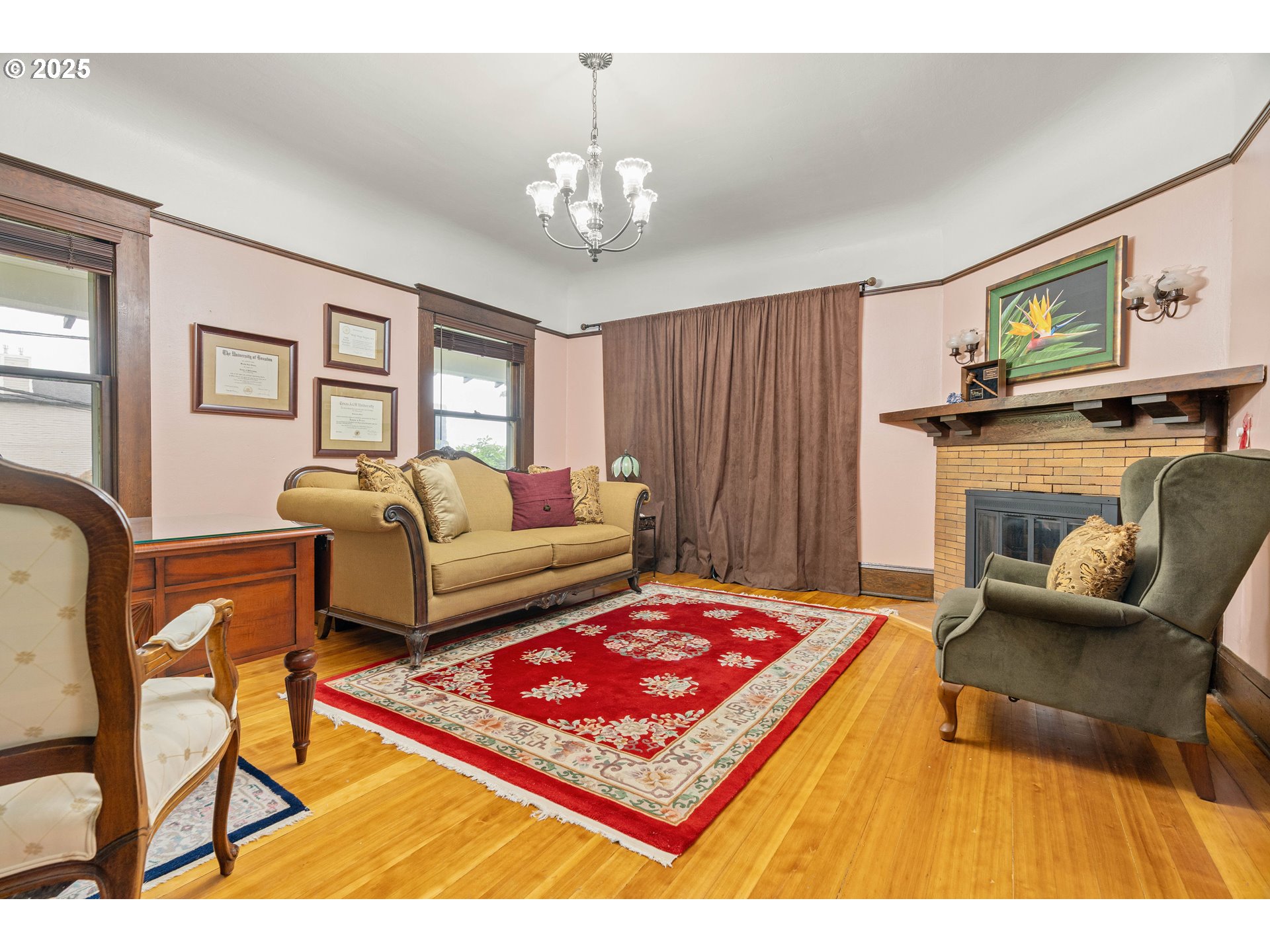3906 South Kelly Avenue Portland, OR 97239 - Photo 11 of 42 a living room with furniture and a chandelier