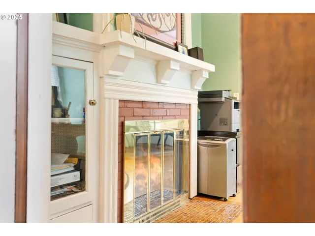 a living room with furniture a flat screen tv and a kitchen view