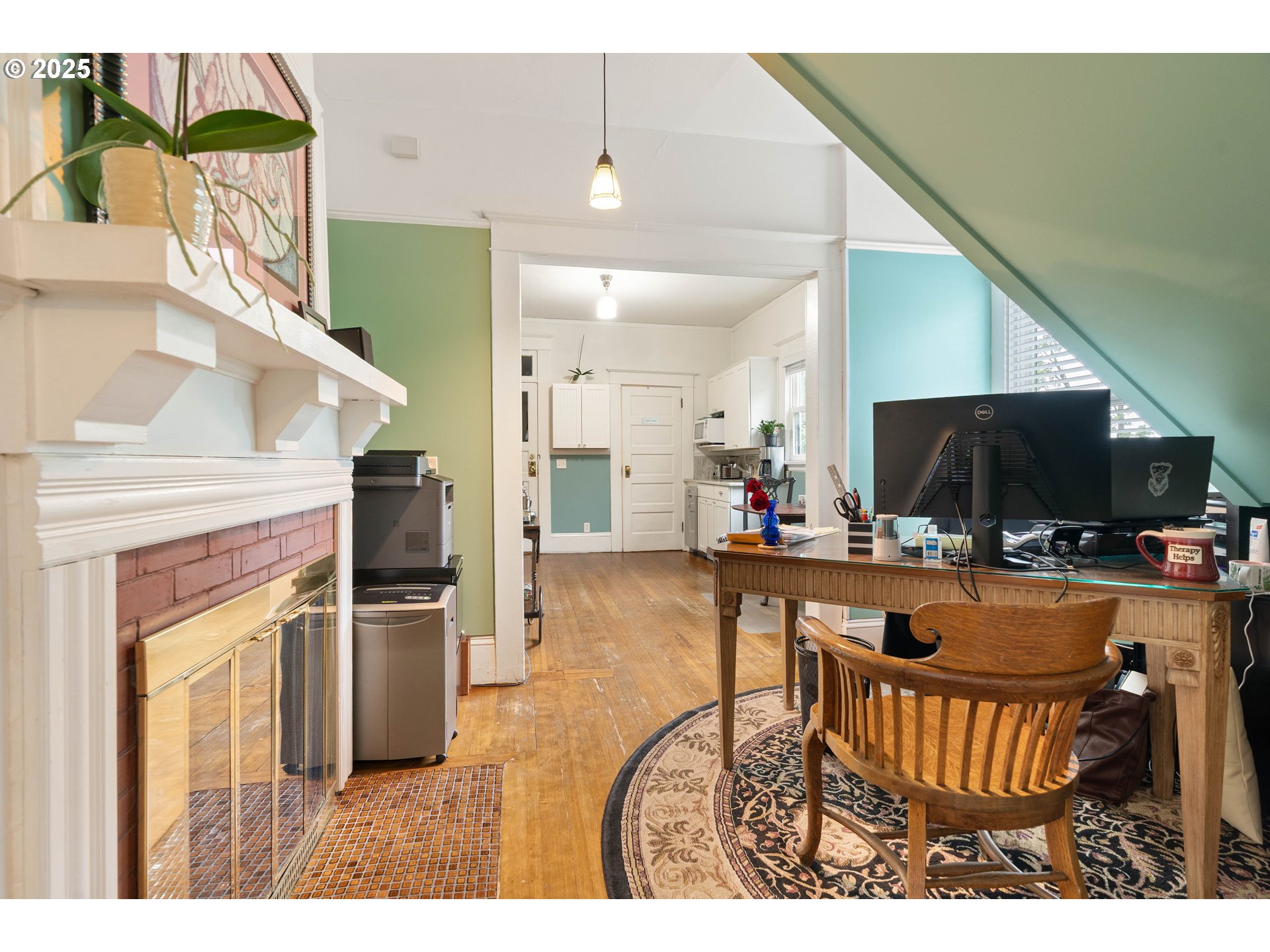 3906 South Kelly Avenue Portland, OR 97239 - Photo 16 of 42 a living room with furniture a flat screen tv and a kitchen view