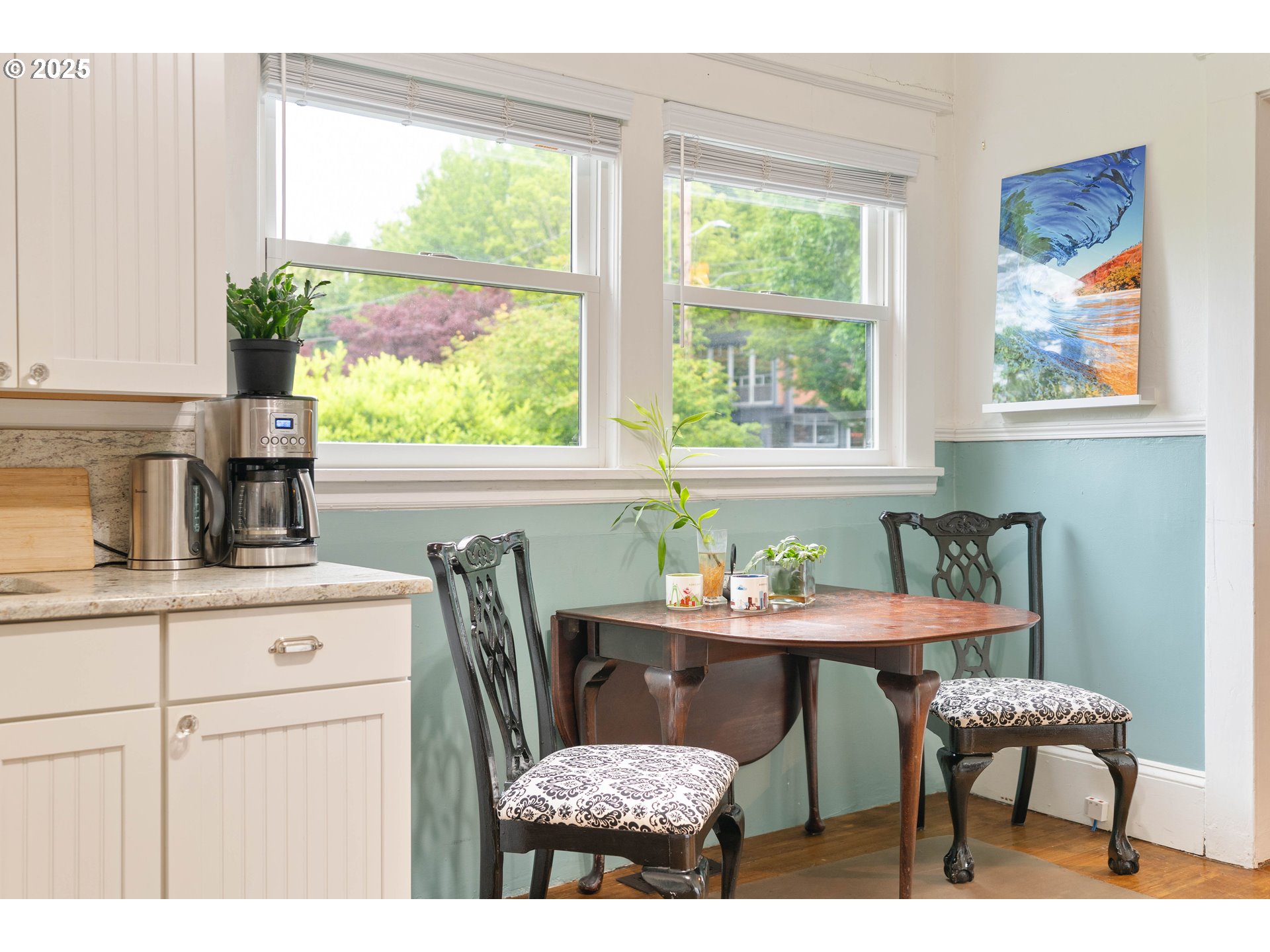3906 South Kelly Avenue Portland, OR 97239 - Photo 18 of 42 a dining room with furniture a window and a kitchen view